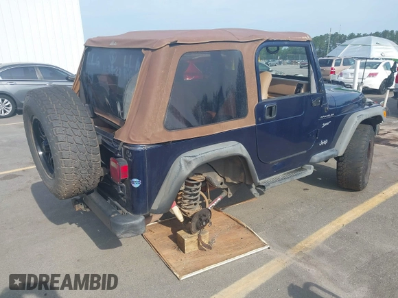 2002 Jeep Wrangler Sport with VIN 1J4FA49S72P729703, listed as a IAAI auction lot 42468446 with 164,342 mi miles and . Bid and sale history available at DreamBid. Image 4.