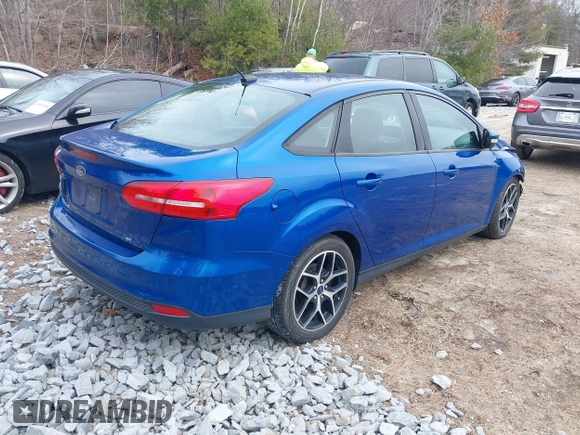 2018 Ford Focus SE z VIN 1FADP3F25JL255840, wystawiony jako IAAI lot #41852913 z przebiegiem 64 010 mil mil oraz . Historia ofert i sprzedaży dostępna na DreamBid. Obrazek 4.