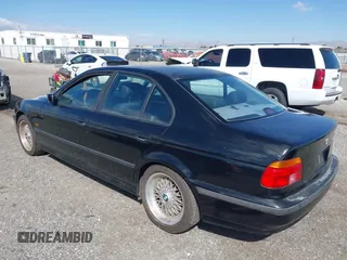 2000 BMW 5 Series 528iA with VIN WBADM6344YGU10257, listed as a IAAI auction lot 41773733 with 231,028 mi miles. Bid and sale history available at carsss.com. Image 3.
