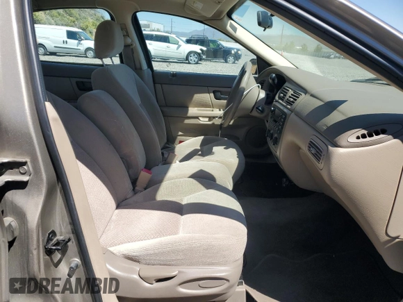 2003 Ford Taurus LX Standard z VIN 1FAFP52U63G277370, wystawiony jako Copart lot #56184345 z przebiegiem 115 778 mil mil oraz Szkoda całkowita • Salvage title. Historia ofert i sprzedaży dostępna na DreamBid. Obrazek 7.