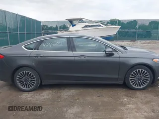 2017 Ford Fusion Titanium with VIN 3FA6P0K96HR208757, listed as a IAAI auction lot 42400172 with 90,000 mi miles and . Bid and sale history available at DreamBid. Image 13.