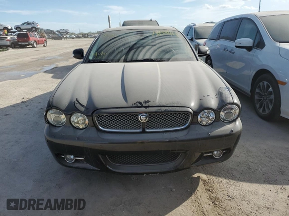 2008 Jaguar XJ with VIN SAJWA71B18SH25255, listed as a Copart auction lot 74781714 with 31,233 mi miles and Salvage Title. Bid and sale history available at carsss.com. Image 5.