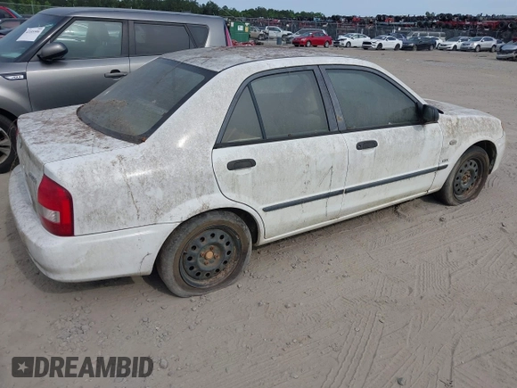 2003 Mazda Protege DX with VIN JM1BJ225730146488, listed as a IAAI auction lot 42086747 with Not Provided miles and . Bid and sale history available at DreamBid. Image 4.