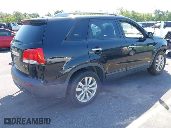 2011 Kia Sorento EX with VIN 5XYKUDA27BG053442, listed as a IAAI auction lot 42062265 with 120,996 mi miles. Bid and sale history available at carsss.com. Image 4.