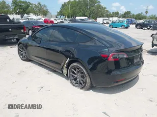 2023 Tesla Model 3 z VIN 5YJ3E1EA0PF571330, wystawiony jako IAAI lot #42198817 z przebiegiem 39 682 mil mil oraz . Historia ofert i sprzedaży dostępna na DreamBid. Obrazek 3.
