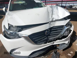 2016 Mazda CX-9 Sport with VIN JM3TCBBY0G0117159, listed as a IAAI auction lot 41302108 with 136,495 mi miles. Bid and sale history available at carsss.com. Image 6.