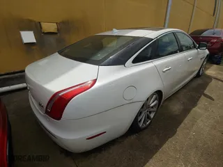 2013 Jaguar XJ with VIN SAJWJ1CD7D8V49599, listed as a Copart auction lot 54008915 with 133,163 mi miles and Clean Title. Bid and sale history available at carsss.com. Image 4.