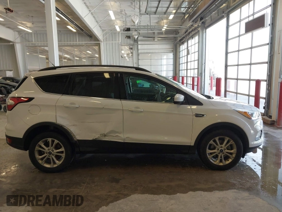 2017 Ford Escape SE z VIN 1FMCU0GD3HUC12658, wystawiony jako IAAI lot #41801033 z przebiegiem 107 662 mil mil oraz . Historia ofert i sprzedaży dostępna na DreamBid. Obrazek 13.
