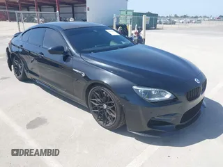 2014 BMW M6 z VIN WBS6C9C52EDV73651, wystawiony jako IAAI lot #42110470 z przebiegiem 127 576 mil mil oraz . Historia ofert i sprzedaży dostępna na DreamBid. Obrazek 1.