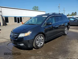 2014 Honda Odyssey Touring with VIN 5FNRL5H99EB088859, listed as a Copart auction lot 54828555 with 147,147 mi miles and Salvage Title. Bid and sale history available at DreamBid. Image 1.