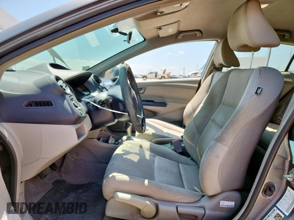 2010 Honda Insight LX with VIN JHMZE2H52AS043392, listed as a Copart auction lot 61347625 with 194,248 mi miles and Salvage title. Bid and sale history available at DreamBid. Image 7.