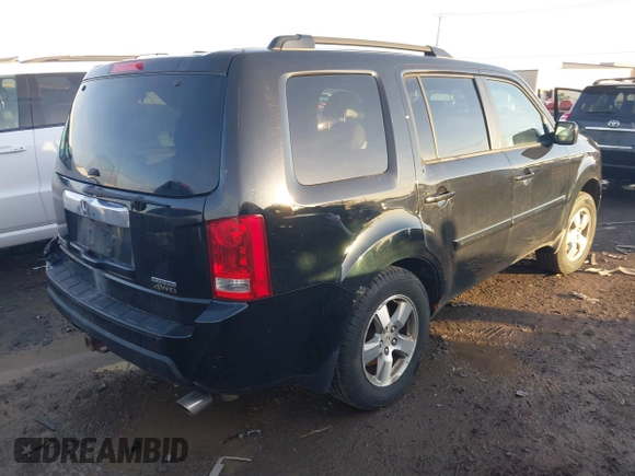 2009 Honda Pilot EX-L with VIN 5FNYF48659B012032, listed as a IAAI auction lot 41801232 with 205,636 mi miles and . Bid and sale history available at carsss.com. Image 4.