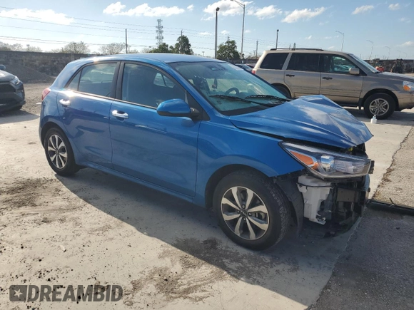 2023 Kia Rio S with VIN 3KPA25AD9PE548173, listed as a Copart auction lot 50232915 with 26,668 mi miles and Salvage Title. Bid and sale history available at DreamBid. Image 4.