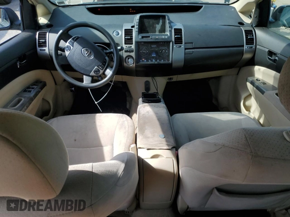2004 Toyota Prius z VIN JTDKB20U640071890, wystawiony jako Copart lot #58633435 z przebiegiem Nie podano mil oraz Czysty tytuł • Clean title. Historia ofert i sprzedaży dostępna na DreamBid. Obrazek 8.