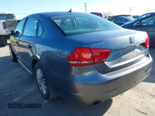 2015 Volkswagen Passat 1.8T Wolfsburg Ed with VIN 1VWAT7A3XFC010262, listed as a IAAI auction lot 41860210 with 99,775 mi miles. Bid and sale history available at carsss.com. Image 3.
