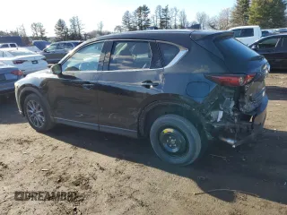 2019 Mazda CX-5 Grand Touring with VIN JM3KFBDM0K0571806, listed as a Copart auction lot 43395105 with 57,768 mi miles and Salvage Title. Bid and sale history available at carsss.com. Image 2.