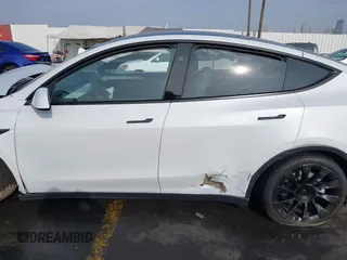 2023 Tesla Model Y Long Range with VIN 7SAYGDEE3PF900030, listed as a IAAI auction lot 41147192 with 13,903 mi miles and . Bid and sale history available at DreamBid. Image 13.