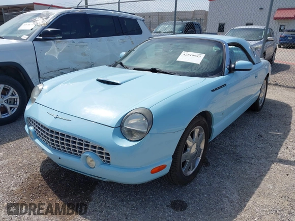 2003 Ford Thunderbird Deluxe z VIN 1FAHP60A53Y101461, wystawiony jako IAAI lot #42519933 z przebiegiem 64 820 mil mil oraz . Historia ofert i sprzedaży dostępna na DreamBid. Obrazek 2.