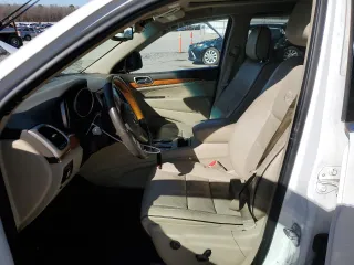 2013 Jeep Grand Cherokee Overland with VIN 1C4RJECG1DC525986, listed as a Copart auction lot 42040775 with 148,784 mi miles and Salvage Title. Bid and sale history available at carsss.com. Image 7.