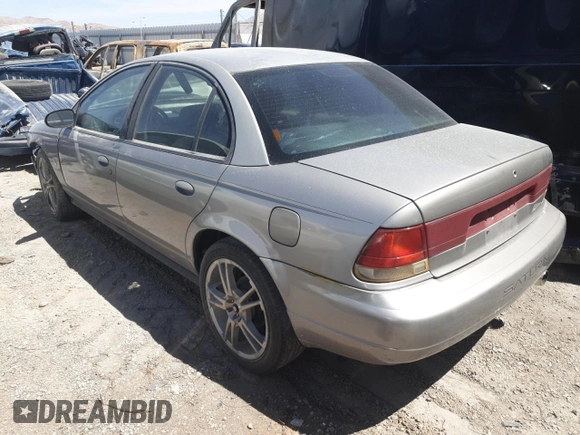 1999 Saturn SL z VIN 1G8ZK5271XZ316032, wystawiony jako Copart lot #50663015 z przebiegiem 164 288 mil mil oraz Nie do naprawy • Non repairable. Historia ofert i sprzedaży dostępna na DreamBid. Obrazek 2.
