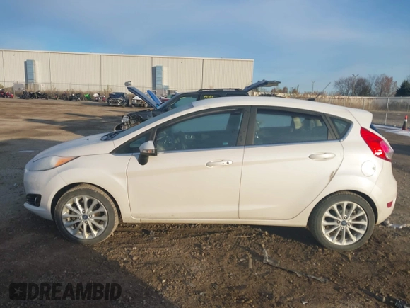 2017 Ford Fiesta Titanium with VIN 3FADP4FJ8HM112435, listed as a IAAI auction lot 41005143 with 75,144 mi miles and . Bid and sale history available at DreamBid. Image 14.