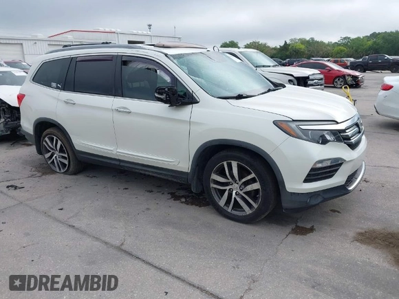 2016 Honda Pilot Elite with VIN 5FNYF6H00GB104329, listed as a IAAI auction lot 41905390 with 125,501 mi miles. Bid and sale history available at carsss.com. Image 1.