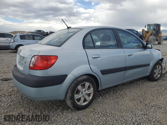 2009 Kia Rio LX with VIN KNADE223496469797, listed as a Copart auction lot 71005774 with 130,675 mi miles and Salvage Title. Bid and sale history available at DreamBid. Image 3.