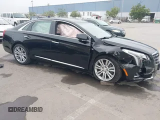 2018 Cadillac XTS Luxury with VIN 2G61M5S33J9119684, listed as a IAAI auction lot 41659807 with 107,156 mi miles and . Bid and sale history available at DreamBid. Image 1.