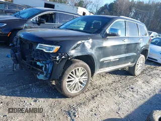 2018 Jeep Grand Cherokee Summit with VIN 1C4RJFJG1JC211047, listed as a IAAI auction lot 41133865 with 66,588 mi miles and . Bid and sale history available at DreamBid. Image 2.