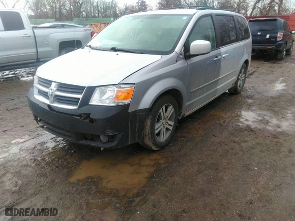 2010 Dodge Grand Caravan SXT with VIN 2D4RN5DX1AR127914, listed as a IAAI auction lot 41720511 with 169,953 mi miles. Bid and sale history available at carsss.com. Image 2.