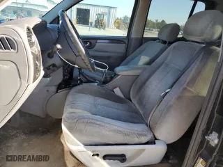 2005 GMC Envoy XL SLT with VIN 1GKET16S256109757, listed as a Copart auction lot 77220144 with 246,444 mi miles and Salvage Title. Bid and sale history available at carsss.com. Image 7.