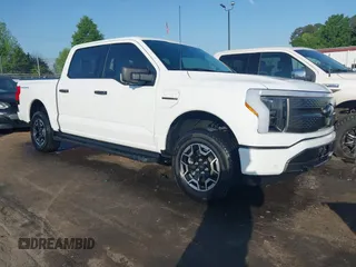 2023 Ford F-150 Lightning Pro with VIN 1FTVW1EL6PWG34059, listed as a IAAI auction lot 42010900 with 20,759 mi miles and . Bid and sale history available at DreamBid. Image 1.