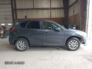 2015 Mazda CX-5 Touring with VIN JM3KE4CY6F0510002, listed as a IAAI auction lot 42045284 with 88,949 mi miles and . Bid and sale history available at DreamBid. Image 14.