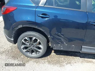 2016 Mazda CX-5 Grand Touring with VIN JM3KE4DY5G0681369, listed as a IAAI auction lot 42102805 with 128,182 mi miles and . Bid and sale history available at DreamBid. Image 17.