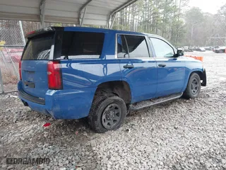 2015 Chevrolet Tahoe Commercial with VIN 1GNSK2EC1FR663199, listed as a IAAI auction lot 41552787 with 148,187 mi miles. Bid and sale history available at carsss.com. Image 4.