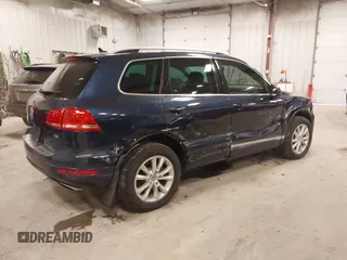 2014 Volkswagen Touareg Sport with VIN WVGEF9BP9ED008967, listed as a IAAI auction lot 41984409 with 193,859 mi miles and . Bid and sale history available at DreamBid. Image 4.