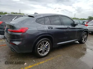 2021 BMW X4 M40i with VIN 5UX2V5C08M9E17162, listed as a Copart auction lot 67602073 with 33,879 mi miles. Bid and sale history available at carsss.com. Image 3.
