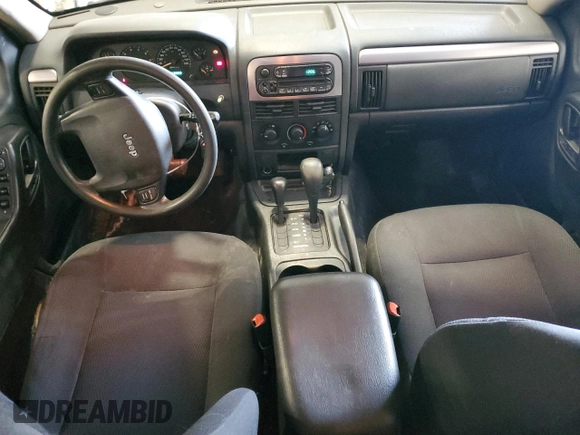 2004 Jeep Grand Cherokee Laredo with VIN 1J4GW48S94C432692, listed as a Copart auction lot 52506585 with 269,983 mi miles and Salvage Title. Bid and sale history available at carsss.com. Image 8.
