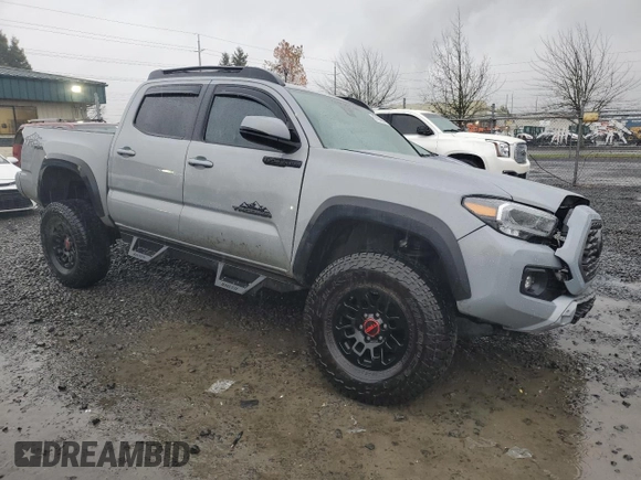 2021 Toyota Tacoma SR with VIN 3TMCZ5AN0MM395357, listed as a Copart auction lot 87086684 with 48,664 mi miles and Salvage title. Bid and sale history available at DreamBid. Image 4.