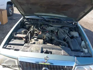 2005 Mercury Grand Marquis GS with VIN 2MEFM74W35X653175, listed as a IAAI auction lot 42005035 with 142,935 mi miles. Bid and sale history available at carsss.com. Image 10.