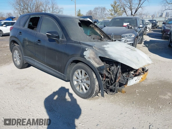 2015 Mazda CX-5 Sport z VIN JM3KE2BEXF0473564, wystawiony jako IAAI lot #41408107 z przebiegiem Nie podano mil oraz . Historia ofert i sprzedaży dostępna na DreamBid. Obrazek 1.