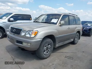 2001 Lexus LX 470 with VIN JTJHT00W713511796, listed as a IAAI auction lot 42222574 with 297,427 mi miles and . Bid and sale history available at carsss.com. Image 2.