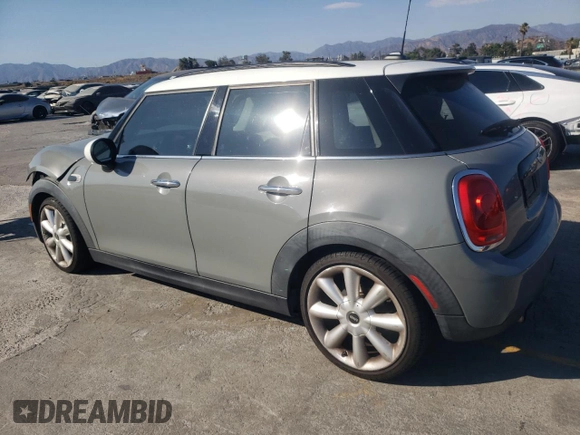 2016 MINI Hardtop 4 Door with VIN WMWXU1C59G2D11117, listed as a Copart auction lot 65191715 with 121,633 mi miles and Salvage title. Bid and sale history available at DreamBid. Image 2.