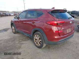 2019 Hyundai Tucson SE with VIN KM8J2CA49KU881841, listed as a IAAI auction lot 41099575 with 129,153 mi miles. Bid and sale history available at carsss.com. Image 3.