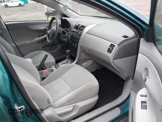 2010 Toyota Corolla with VIN 1NXBU4EE3AZ165944, listed as a IAAI auction lot 42597459 with 211,824 mi miles and . Bid and sale history available at DreamBid. Image 5.