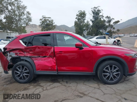 2018 Mazda CX-5 Grand Touring with VIN JM3KFADMXJ0302656, listed as a IAAI auction lot 42099173 with 125,378 mi miles and . Bid and sale history available at DreamBid. Image 13.