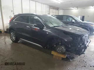2023 Cadillac XT4 AWD Premium Luxury z VIN 1GYFZDR43PF174188, wystawiony jako Copart lot #59106355 z przebiegiem 27 530 mil mil oraz Szkoda całkowita • Salvage title. Historia ofert i sprzedaży dostępna na DreamBid. Obrazek 4.