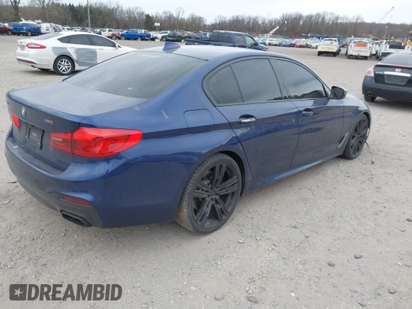 2018 BMW 5 Series M550i xDrive with VIN WBAJB9C56JG463891, listed as a IAAI auction lot 41731556 with 104,860 mi miles. Bid and sale history available at carsss.com. Image 4.