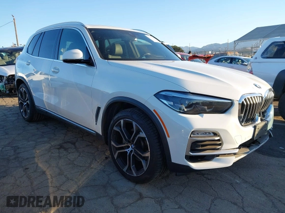 2021 BMW X5 sDrive40i with VIN 5UXCR4C03M9G59554, listed as a IAAI auction lot 41358056 with 47,577 mi miles. Bid and sale history available at carsss.com. Image 1.
