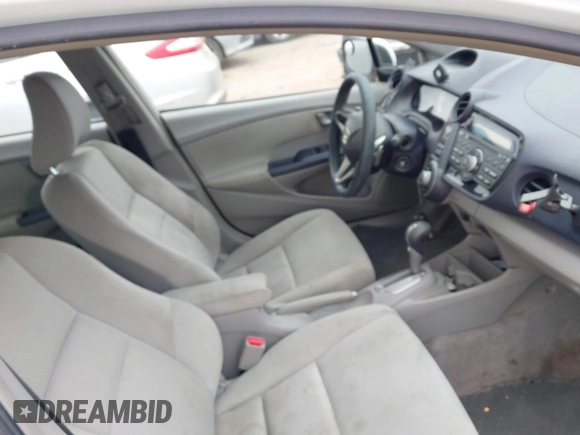 2010 Honda Insight EX with VIN JHMZE2H71AS035091, listed as a IAAI auction lot 41380128 with 181,653 mi miles and . Bid and sale history available at DreamBid. Image 5.